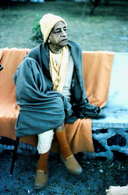 Prabhupada sitting on bench
