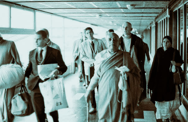 Srila Prabhupada in an airport in the early days