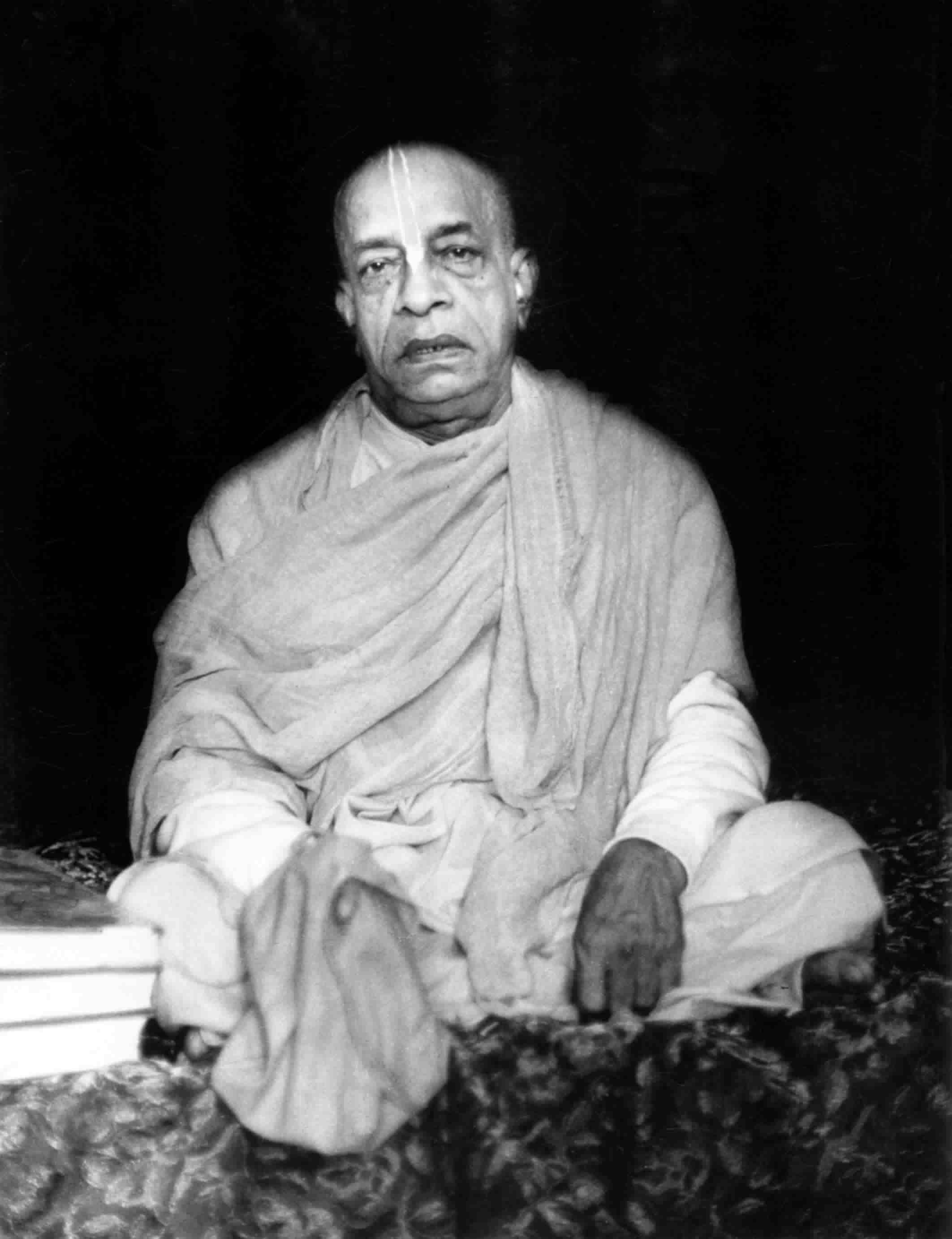 Srila Prabhupada looking very grave with japa mala in hand