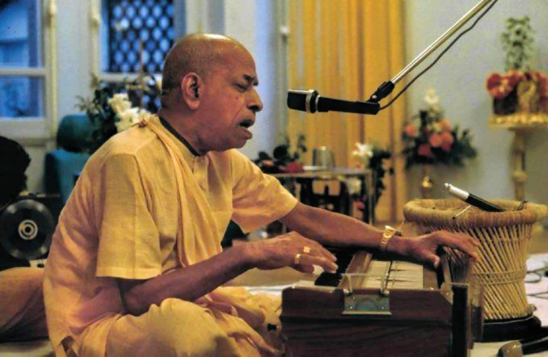 Prabhupada plays harmonium